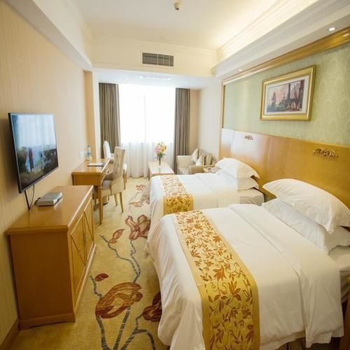 Vienna International Hotel Lijiang Yuxue Avenue Экстерьер фото